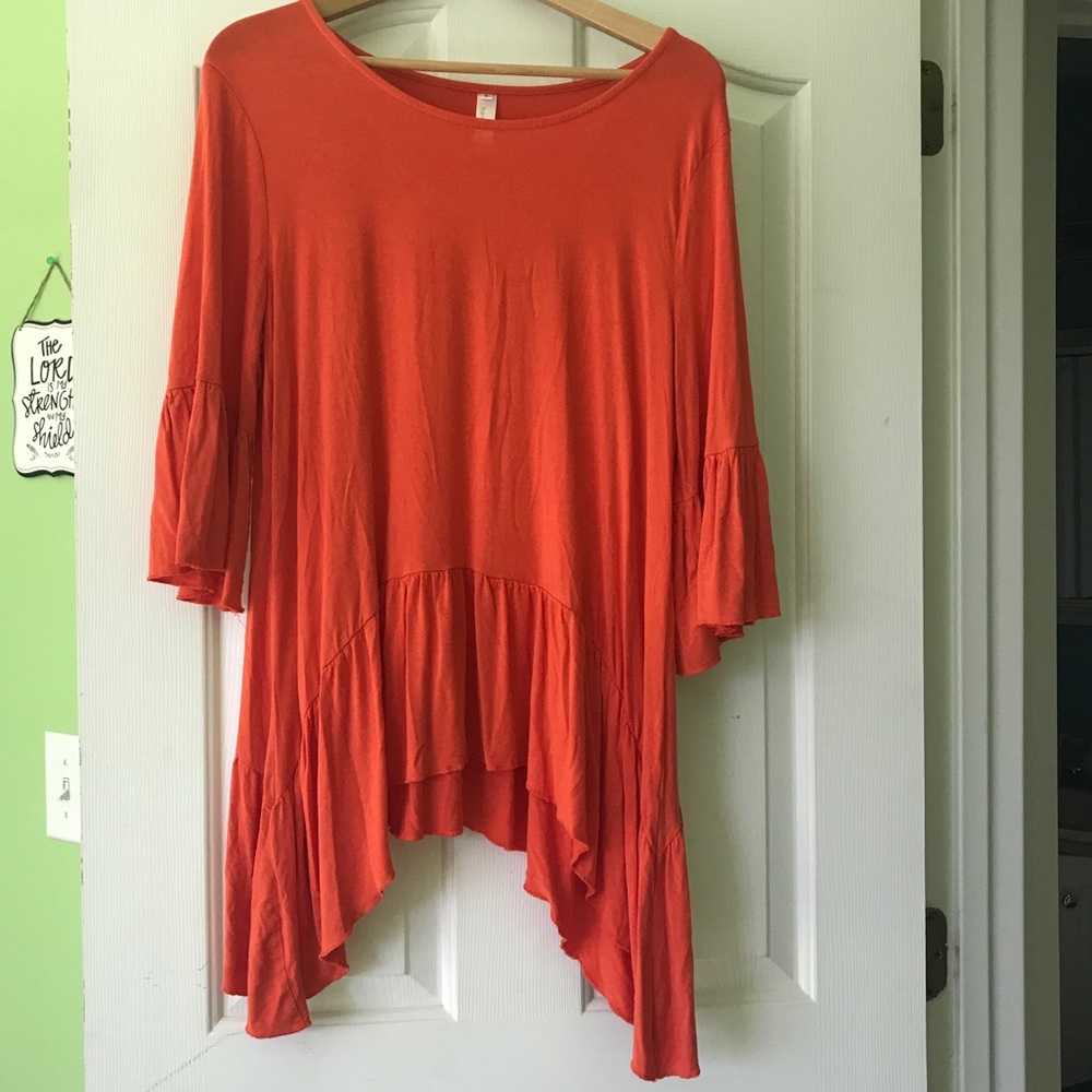 Long Orange top with ruffle sleeves. Super comfy.